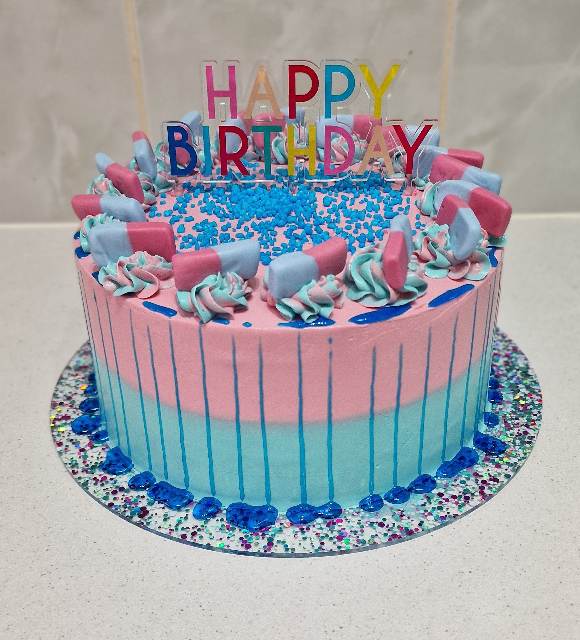 Vibrant blue and pink custom bubblegum-flavoured birthday celebration cake by Fontaines Fancies