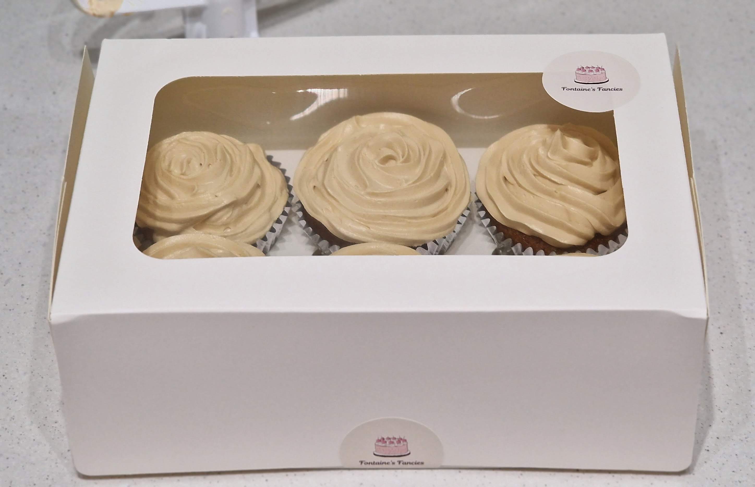 Presentation box of freshly baked Fontaines Fancies Biscoff cookie spread swirl cupcakes