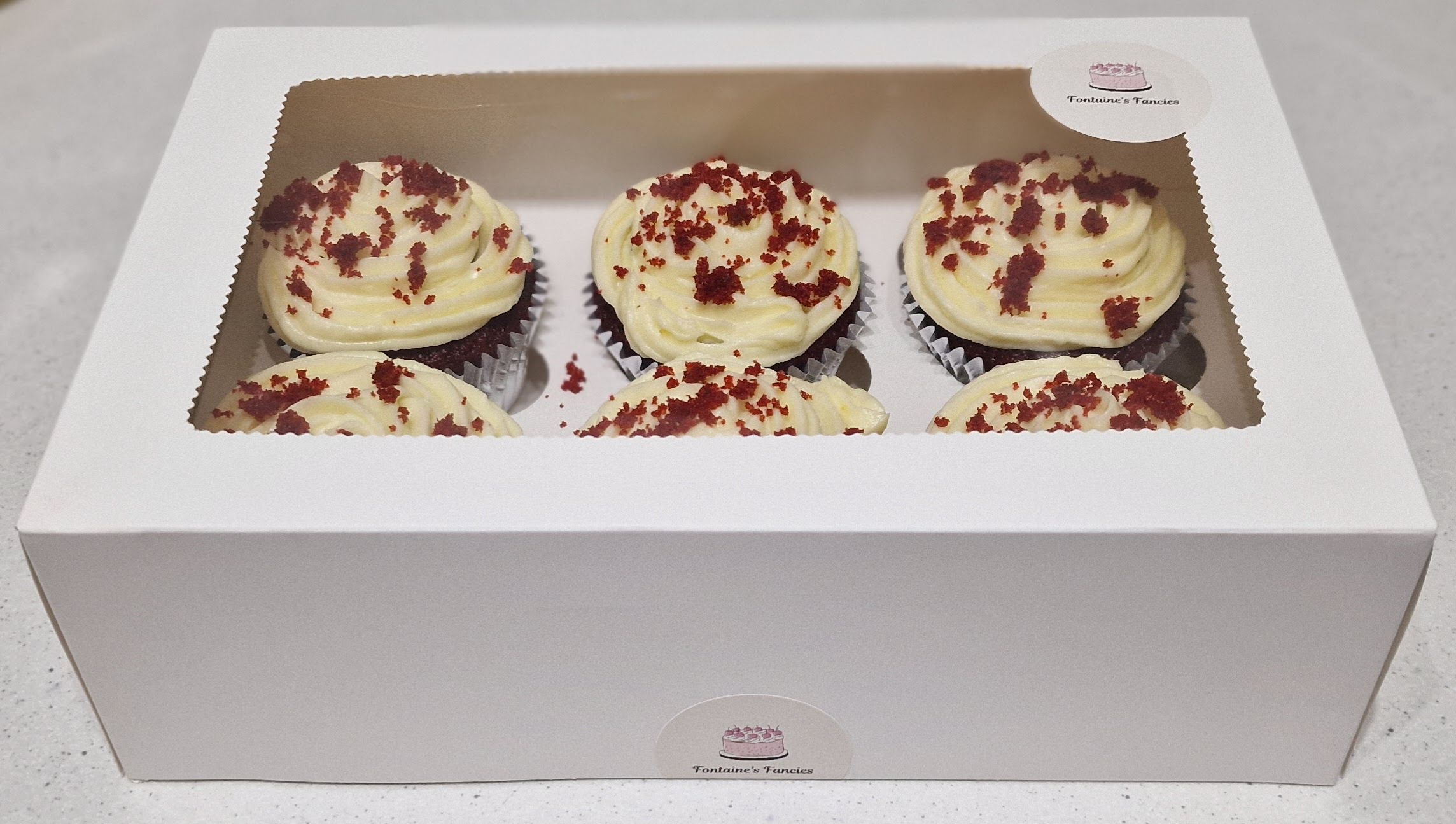 Box of fresh handcrafted red velvet cupcakes by Fontaines Fancies